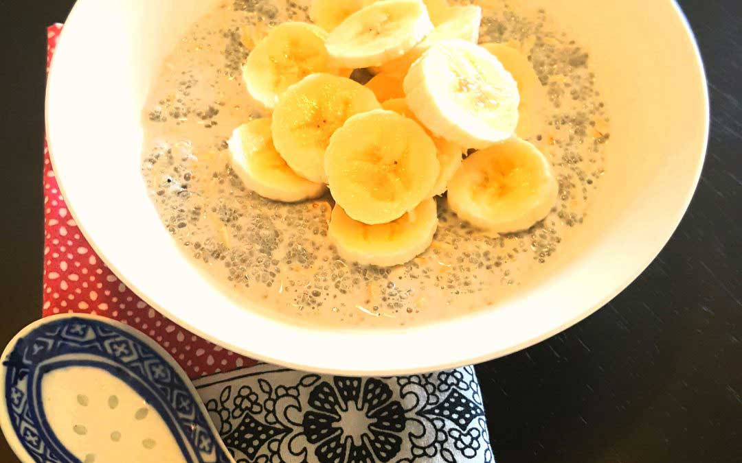 bowl of chia seed pudding with sliced bananas on top